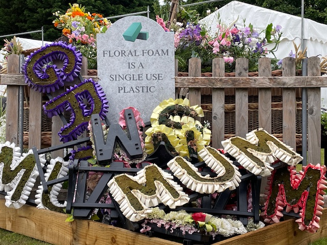 pile of used flower displays from a crematorium